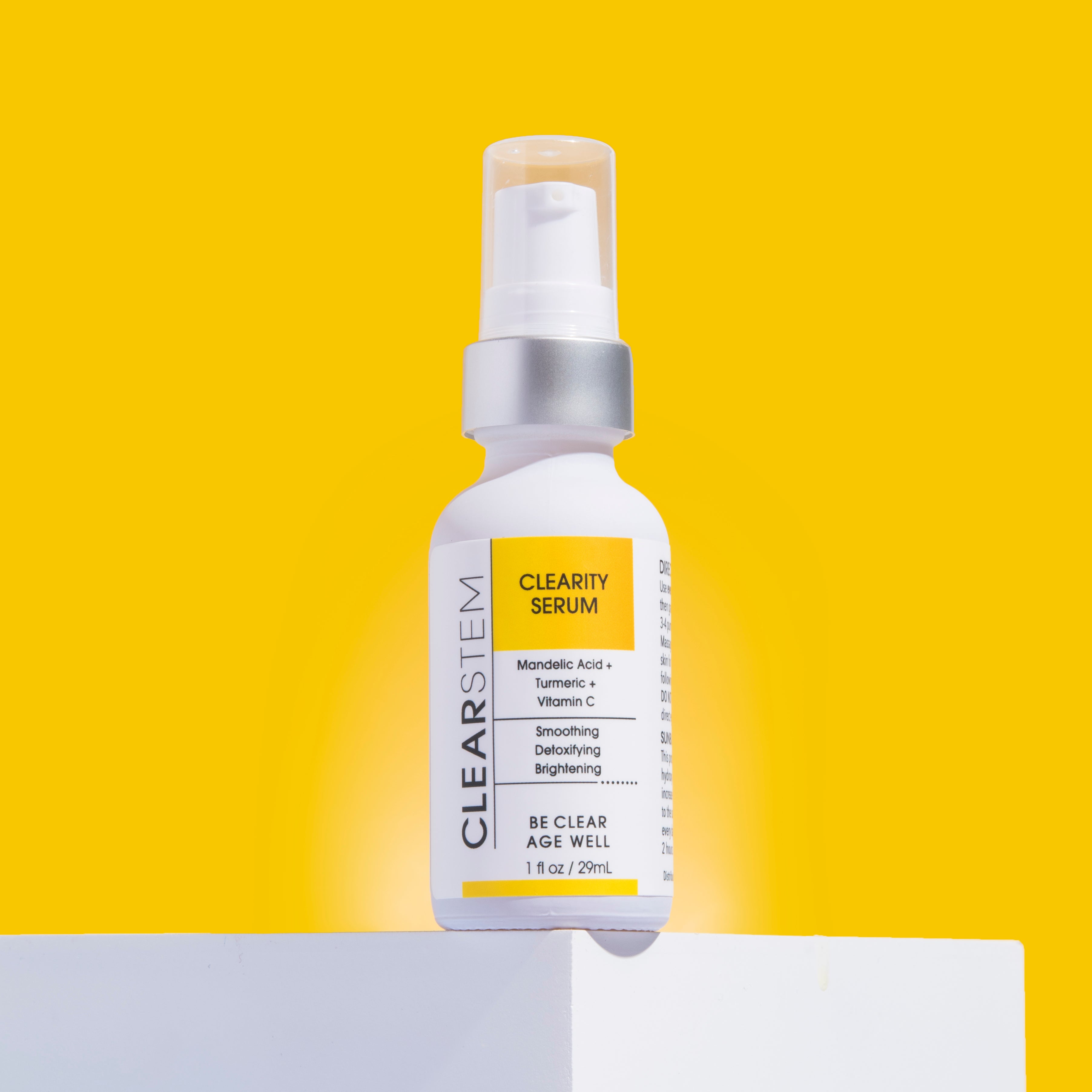white clearstem clearity serum bottle with yellow background