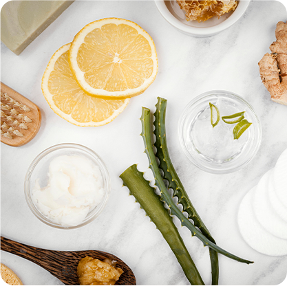 pore clogging ingredients Aloe vera, lemon, ginger and other ingredients on a table - Clearstem