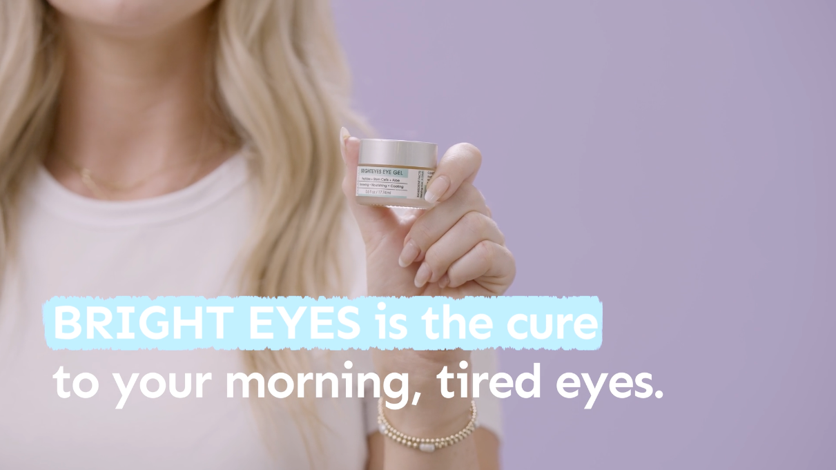 a woman holding container of clearstem brighteyes eye gel